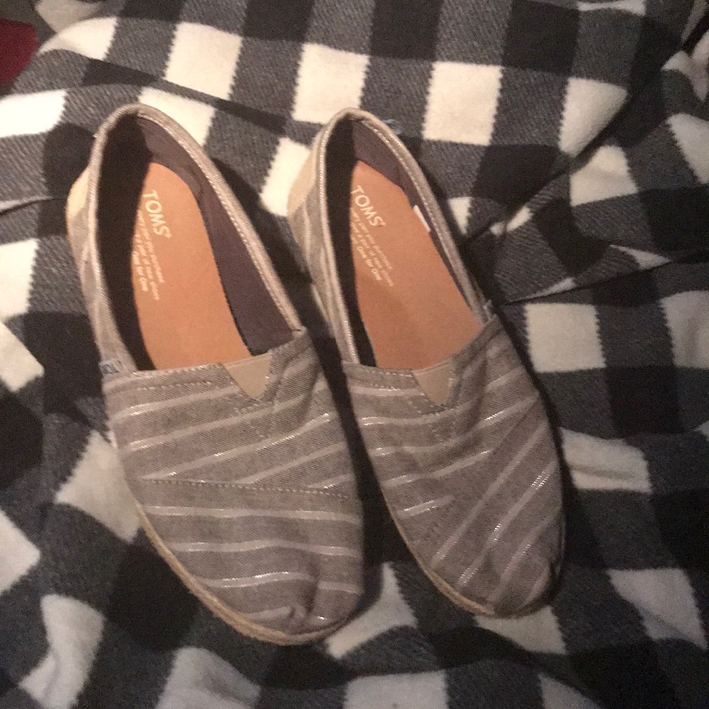 Toms slip on a shoes.